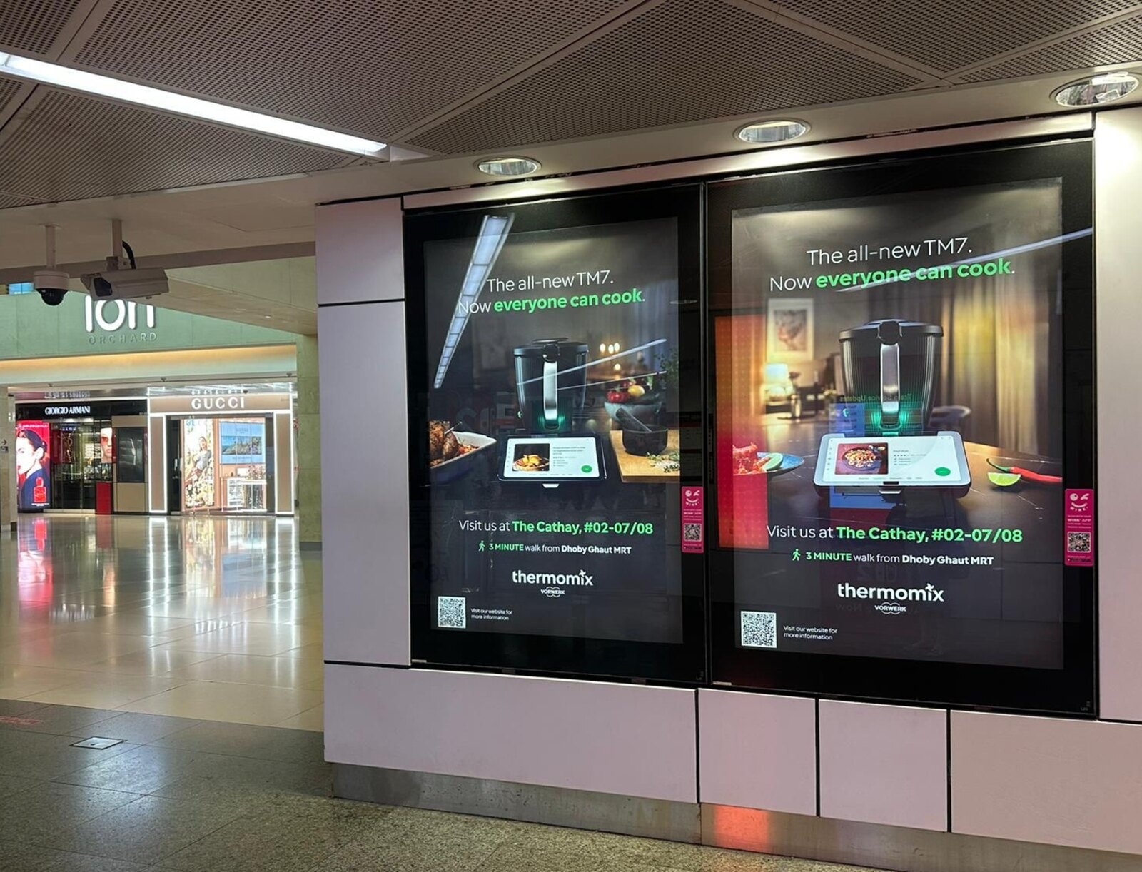 Two TM7 posters live in the underpass at ION Orchard